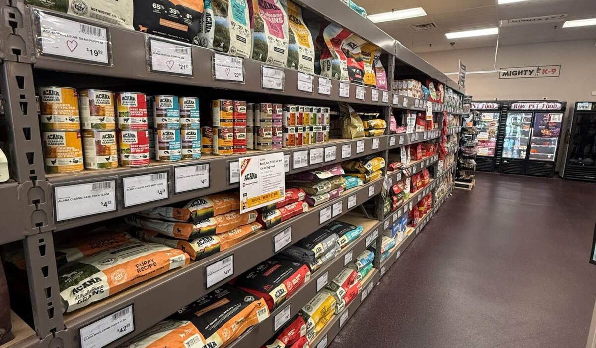 Pet food and supplies on shelves at Mighty Pet in Menominee MI